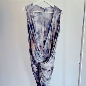 Beautiful tie-dye dress. Deep cut with leg slit. Hugs the butt. Barely worn